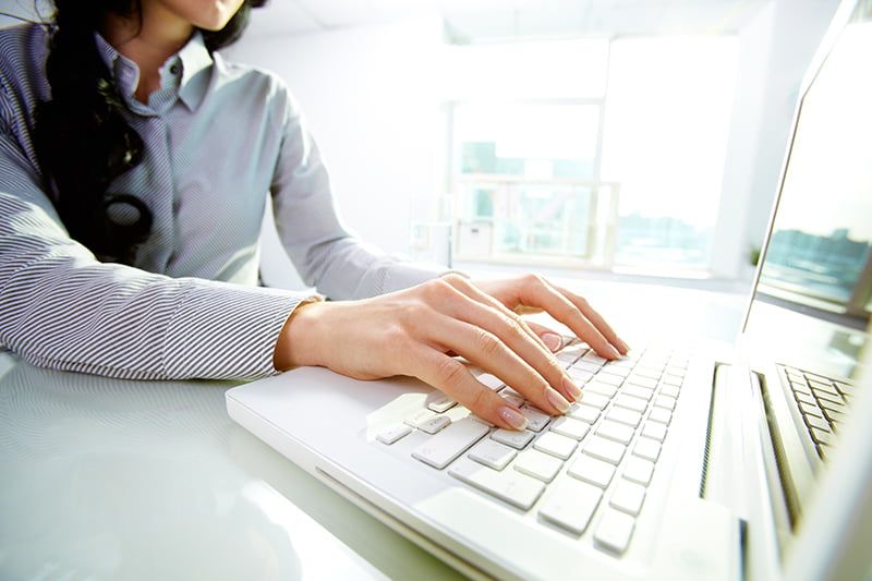 12620700 - business lady typing on laptop at office