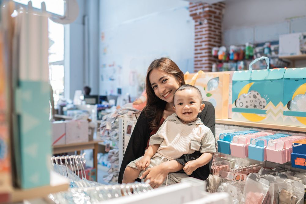 asian-mother-with-her-toddler-boy-shopping-in-the-baby-shop